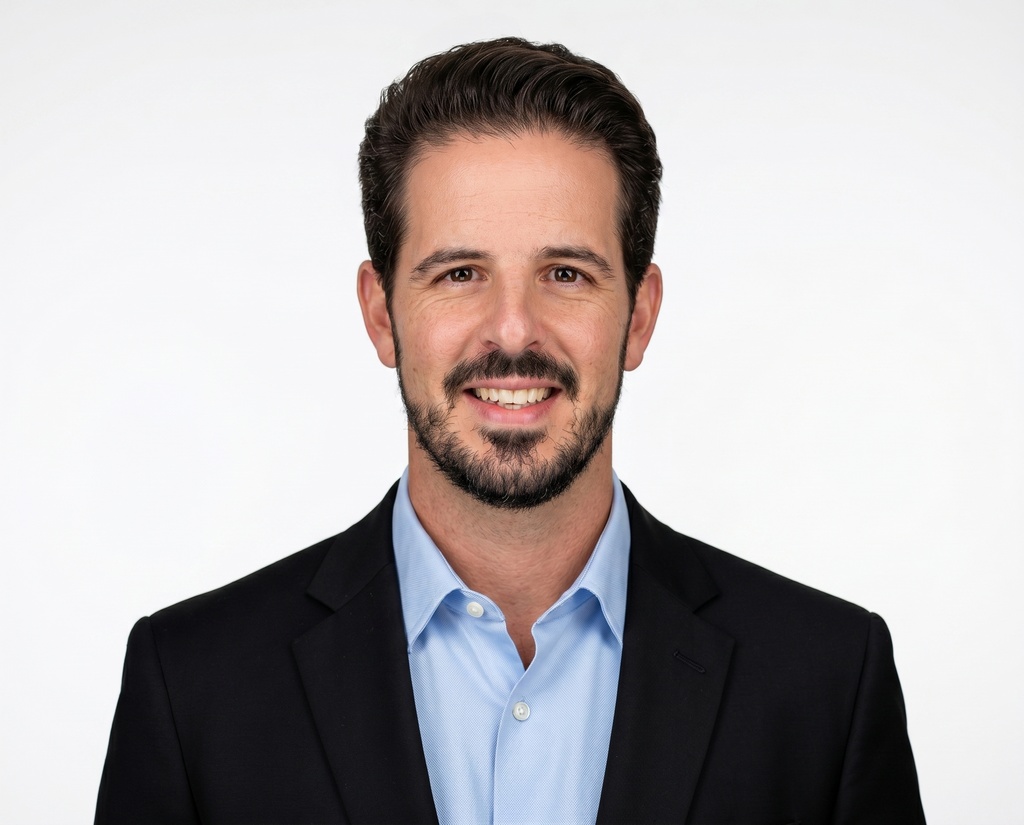 Antonio's headshot, white studio backdrop