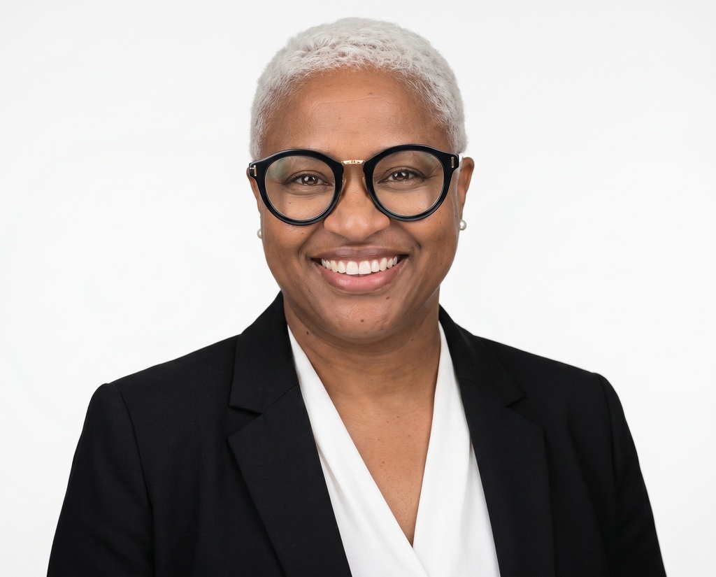 Jackie's headshot, white studio backdrop