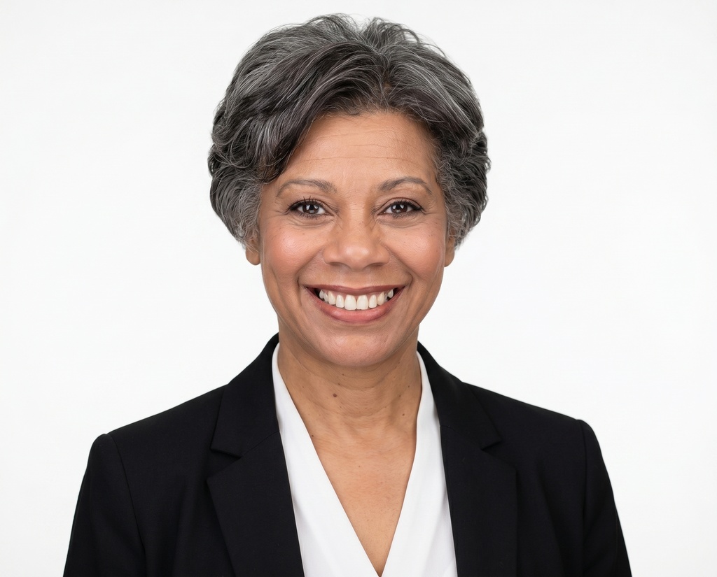 Example corporate headshot 1 of 8 in the White studio style, same backdrop as the rest of the team