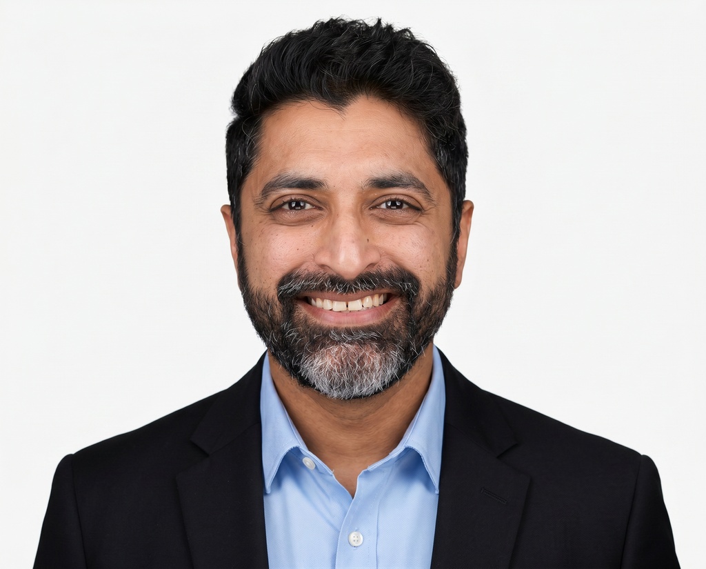 Example corporate headshot 4 of 8 in the White studio style, same backdrop as the rest of the team